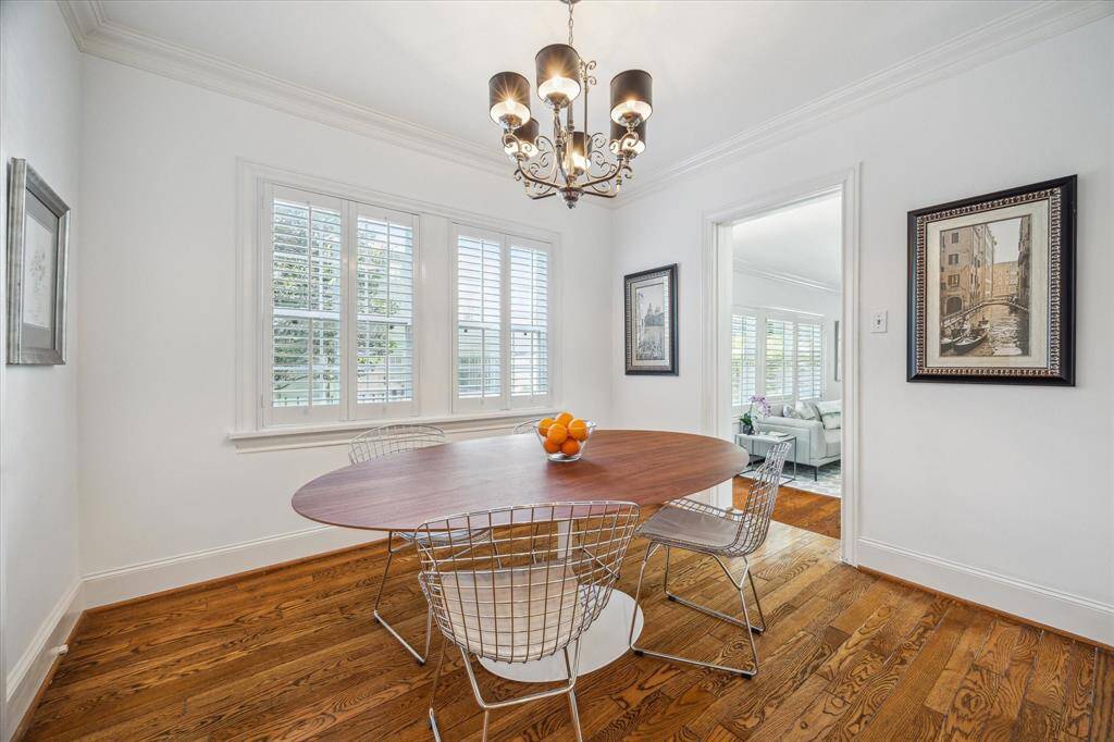 This is a view of the breakfast room with a doorway that leads to the flex room and backyard.