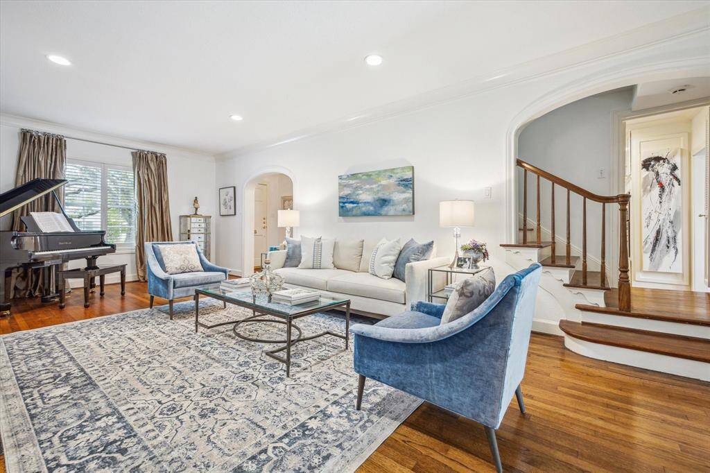 The windows of the home have been replaced with double pane, argon gas windows to make the home more energy efficient. To the right of the windows is the entry hall with the dining room just on the other side.
