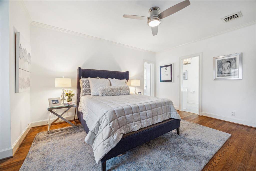 The master bedroom has a door to the right of the sunroom that leads to the en suite bathroom.