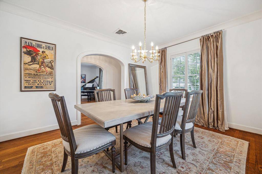 Here is another view of the dining room with the entry hall located on the other side of the dining table.