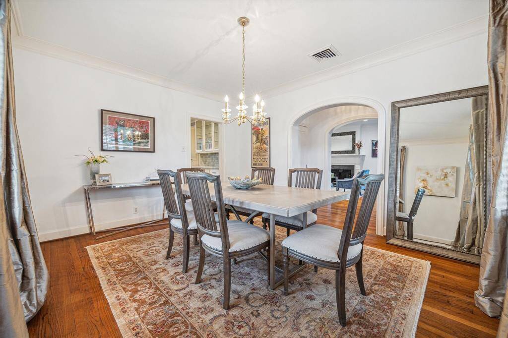The dining room measures 14' x 12' and receives an abundance of natural light.  The entry to the kitchen is to the left of the arched, cased opening.