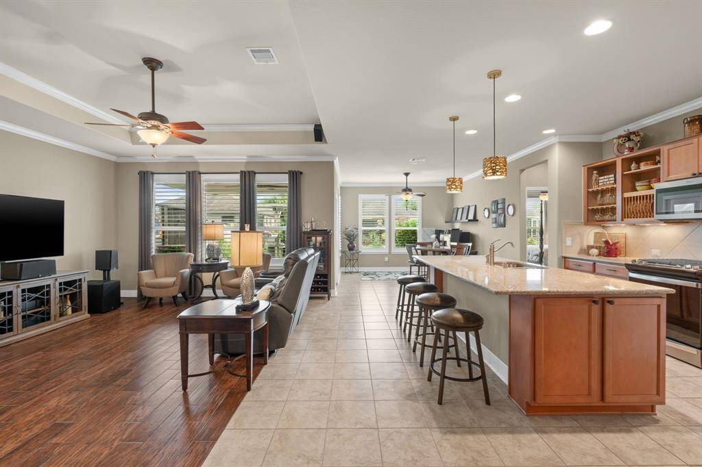 A perfect shot showcasing the open-concept design and seamless transition from the kitchen into the inviting gathering room—ideal for entertaining and everyday living.