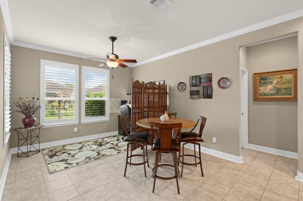 The dining room and breakfast area offer stunning views of the outdoor haven, creating a peaceful backdrop for every meal.