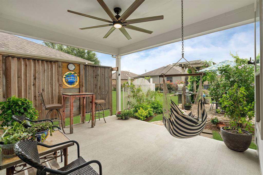 Spacious patio with custom adjustable slats—offering flexible shade and comfort for outdoor relaxing or entertaining.
