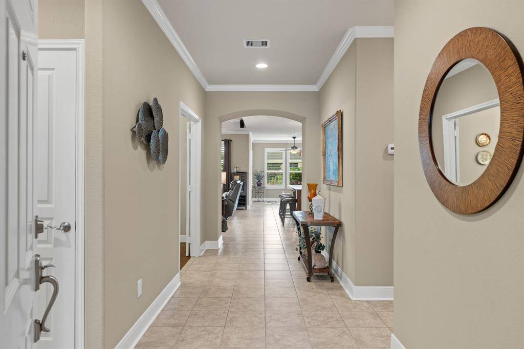 The open foyer provides ample space for a console table, artwork, or a decorative mirror—setting the stage for a stylish and inviting entry.