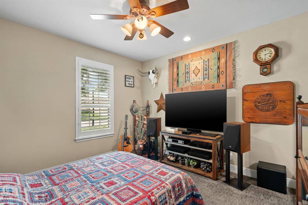 Just off the entry foyer, the guest room is tucked away to the left—offering privacy and comfort for visiting friends and family.