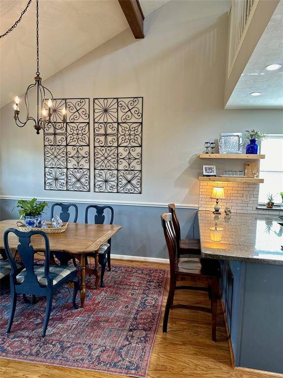 The breakfast bar separates the kitchen and dining rooms.