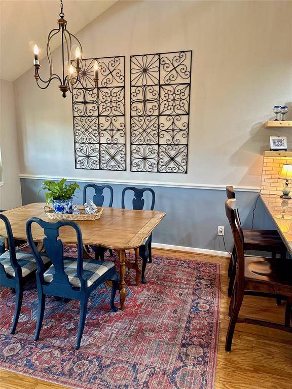 A nice chandelier accents the dining room.