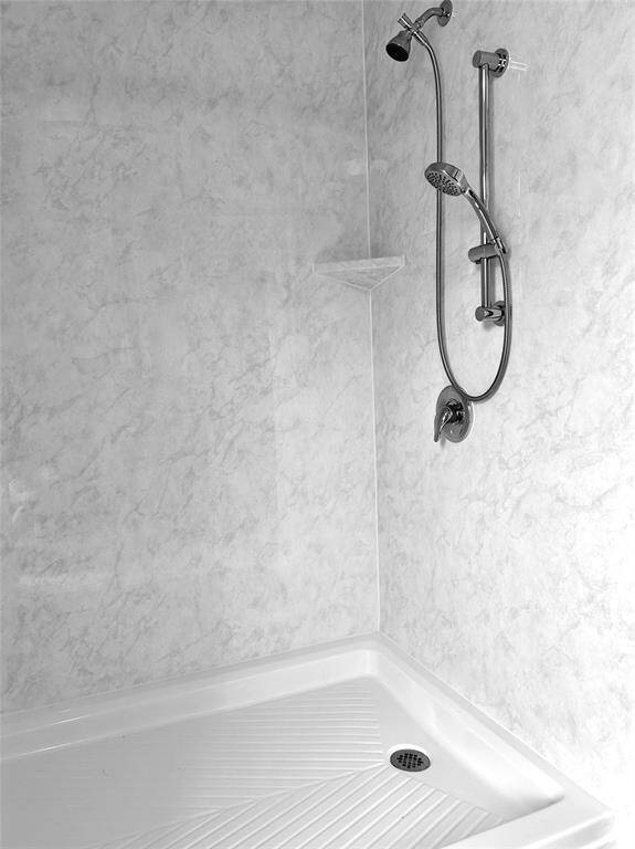 The tub/shower has been replaced and remodeled with a beautiful standing shower.