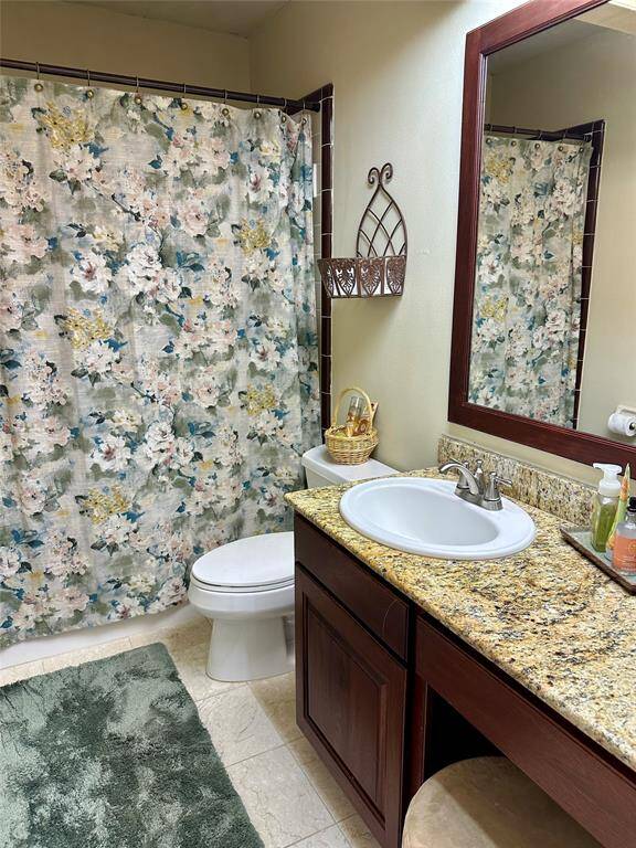 The secondary bath has a tub/shower and a vanity area.