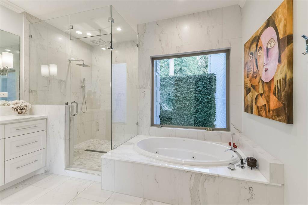 Separate shower and tub in primary bath.