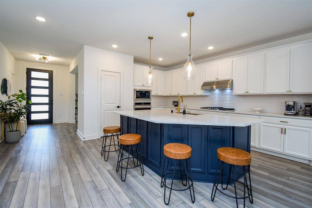 The front door opens into a space that feels both expansive and well-balanced.
