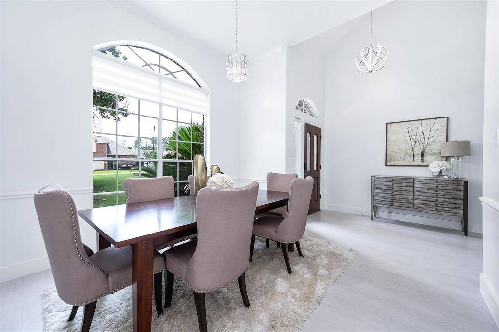 Elegant Formal Dining with updated lighting