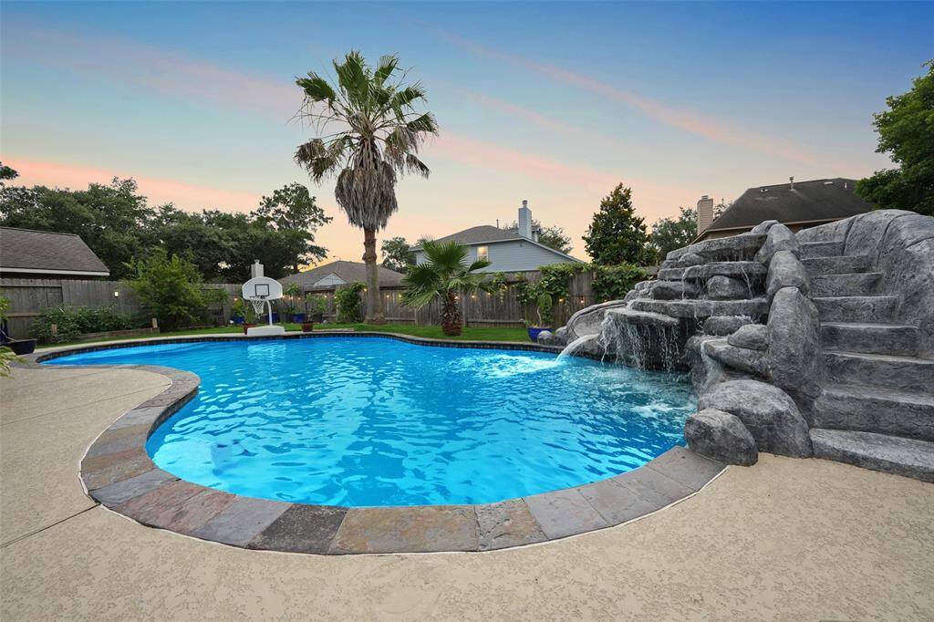 Private backyard with huge pool and slide