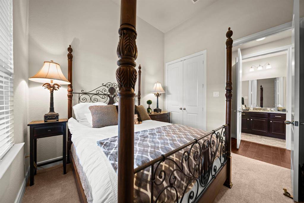 The secondary bathroom downstairs is just across the hall from this lovely bedroom