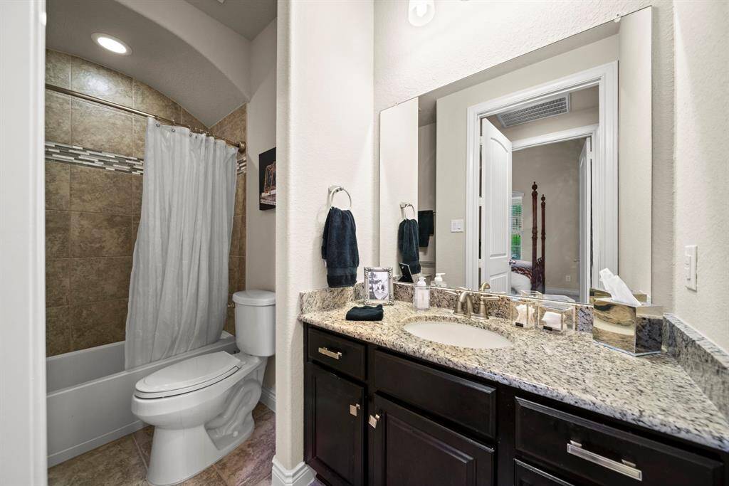 This bathroom has handle grips and is wheelchair accessible