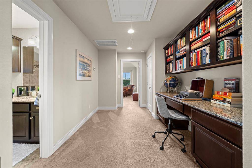 The desk space is located between the upstairs bedroom and the gameroom