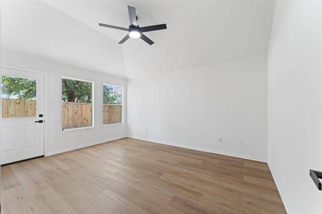 Master bedroom with view and direct access to backyard