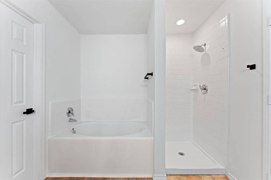 Bathtub and shower separate in master bedroom