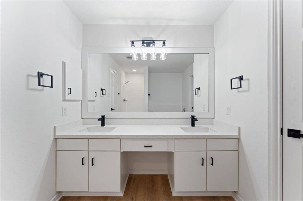Master bedroom vanity/ his and hers sink, quartz countertop, waterfall faucet.
