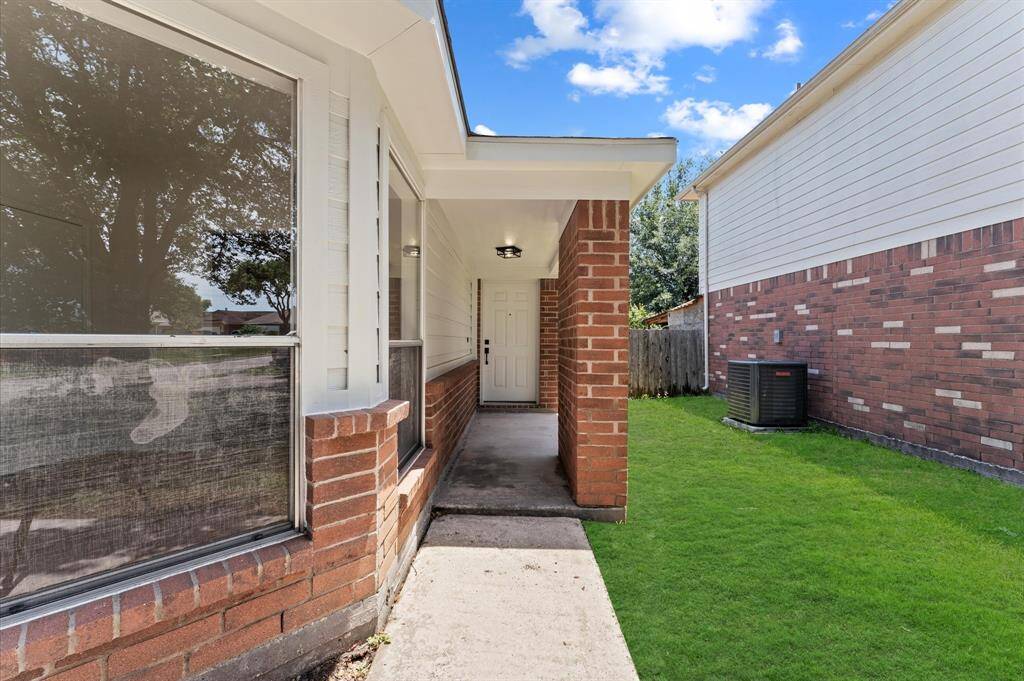 Entrance of home, window has a view of breakfast table area