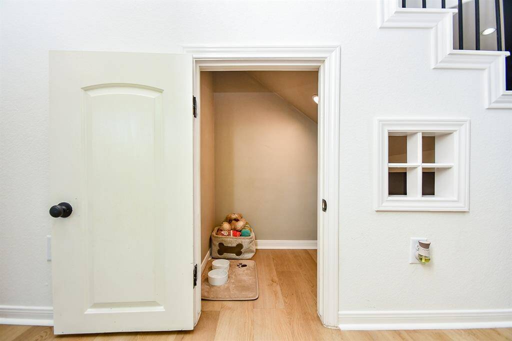 Who doesn't love a cozy little "cupboard under the stairs" for your furry friends?