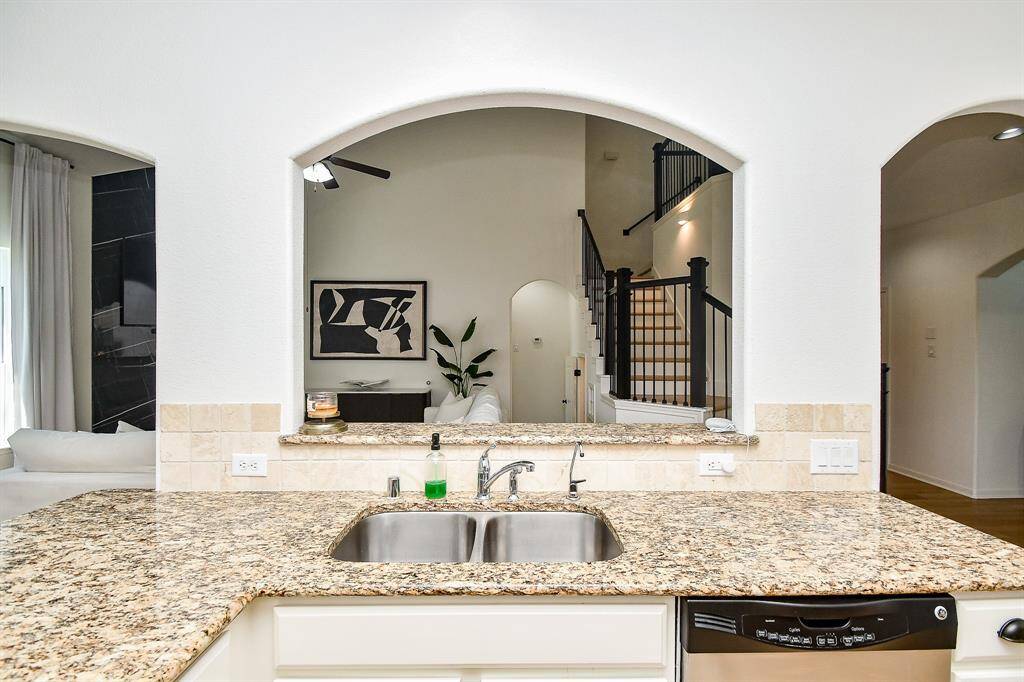 The breakfast bar creates an inviting area for entertaining.