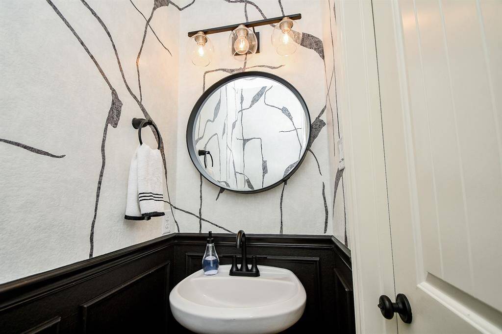 Half bath off of the foyer.
