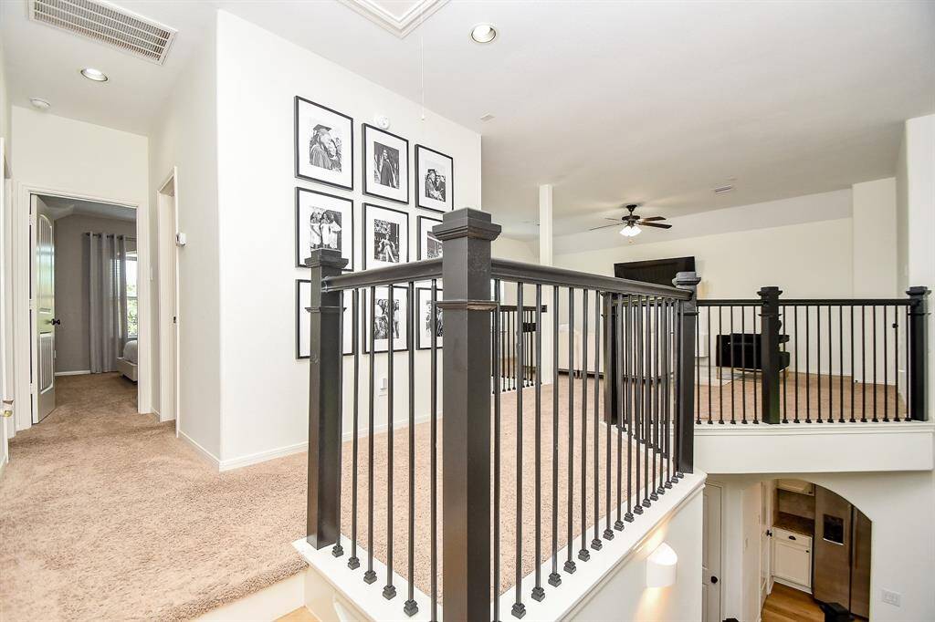Hallway leads to 3 spacious secondary bedrooms and a full bathroom.