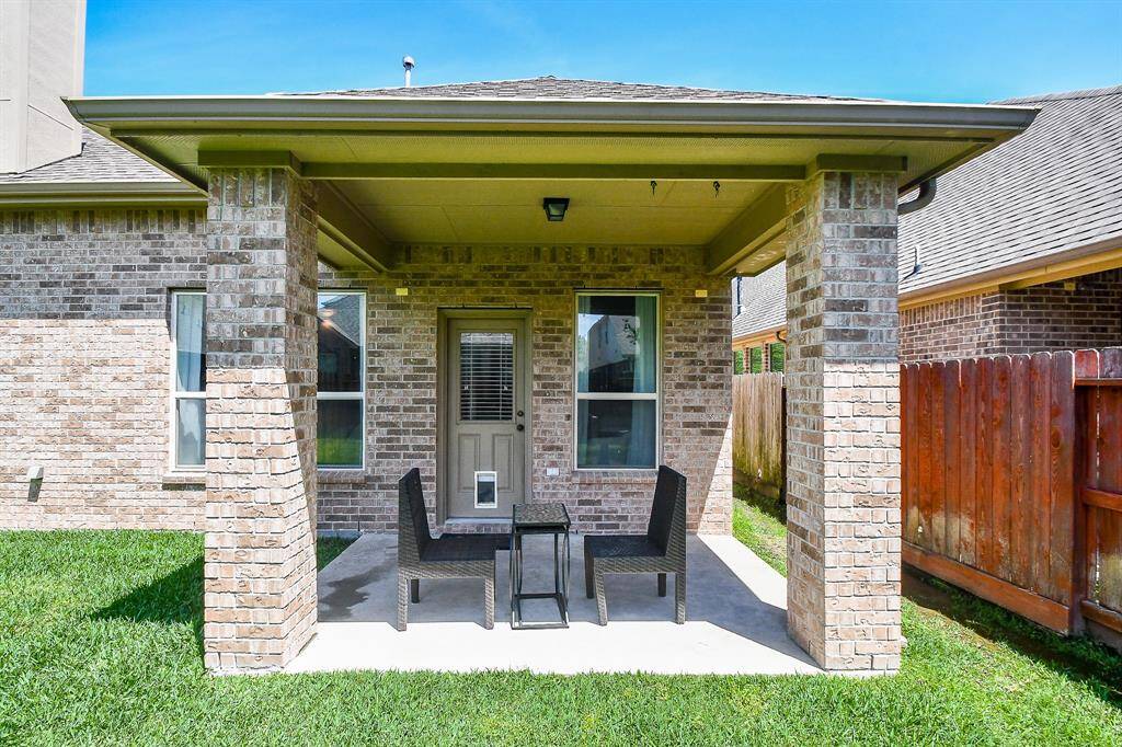 Enjoy your backyard under this covered porch.