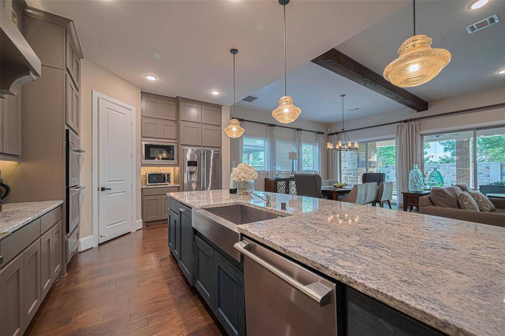 Open floorplan from the kitchen to the living room and dining room is the perfect space for gathering