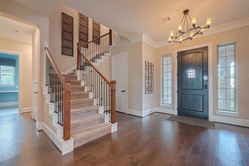 Exquisite wood floors carry from the entry through living spaces, and every corner has the highest detail of design