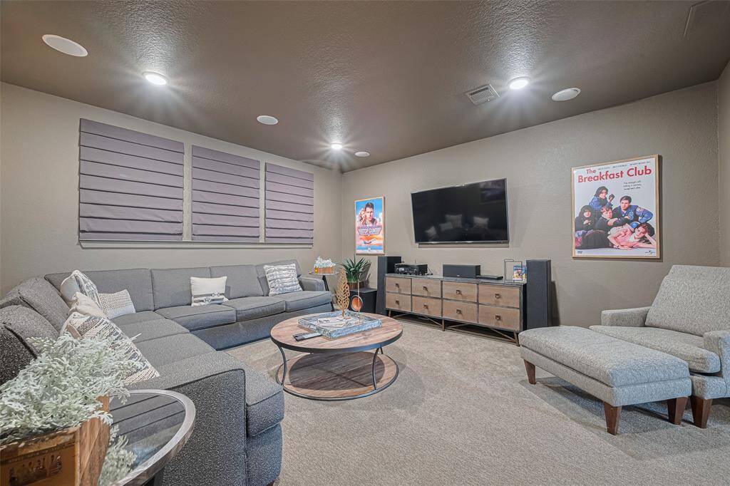 Custom window covers to block out light, surround sound speakers and elevated from the game room really makes it feel like a true theater experience