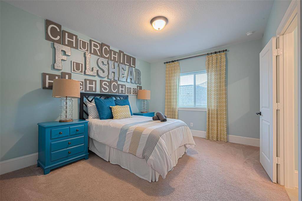Bedroom number three located upstairs with a Jack and Gill bathroom shared with  bedroom number four