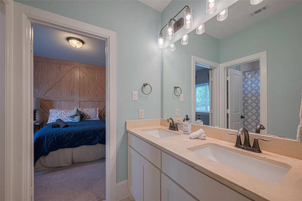 Jack and Jill bath for bedrooms three and four and each have their own sink