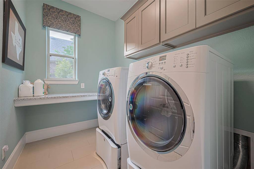 Oversize laundry room, which actually has access to the primary bedroom