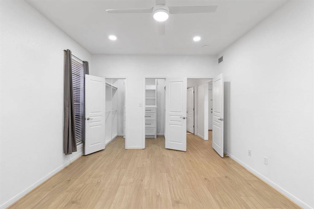 Room showcasing walk-in closet