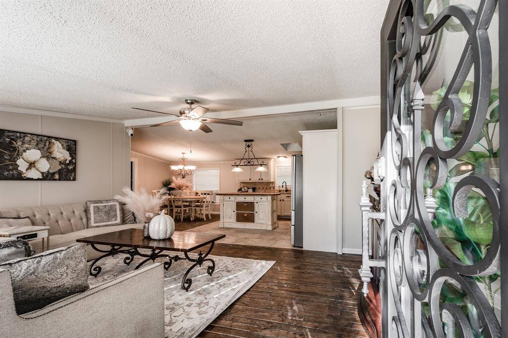 Welcome Home!! Look at the beautiful iron work and real wood floors throughout this home.