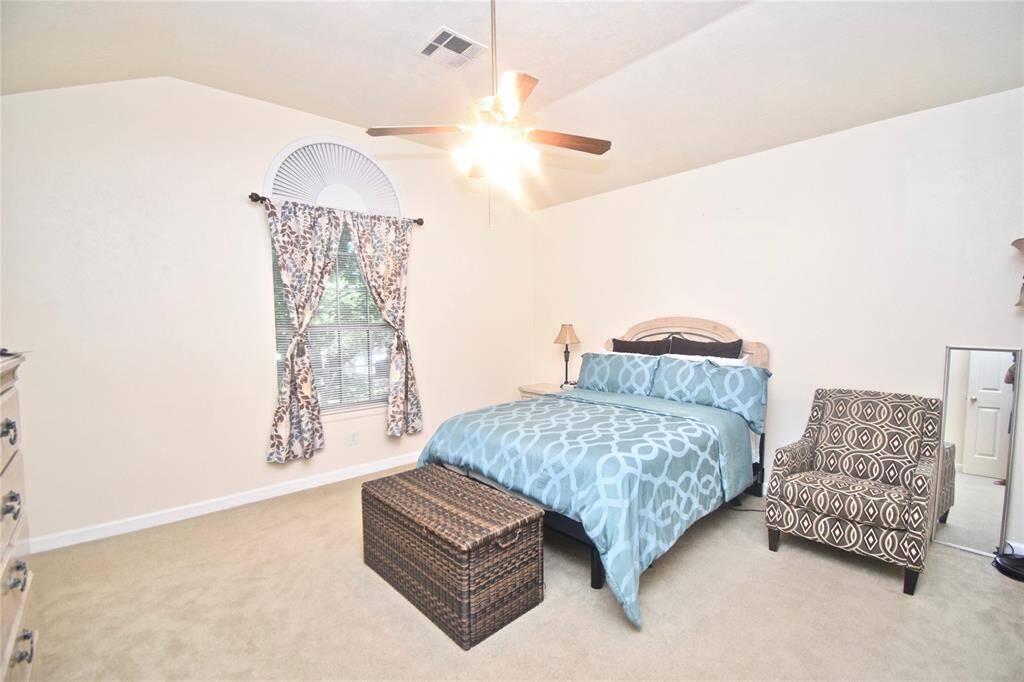 Enjoy a spacious primary  suite featuring high celings.