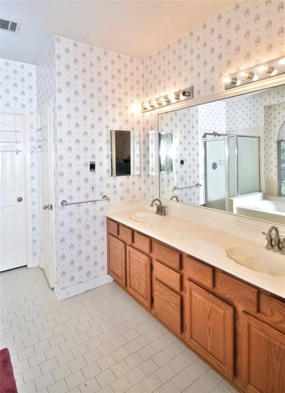 The primary bath offers you dual sinks.