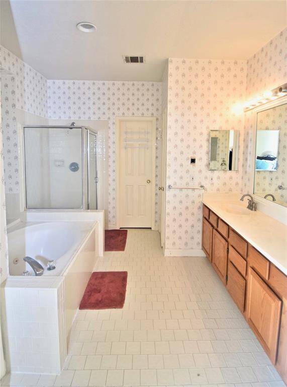 In addition, enjoy a relaxing whirlpool tub + separate shower in the primary bath.