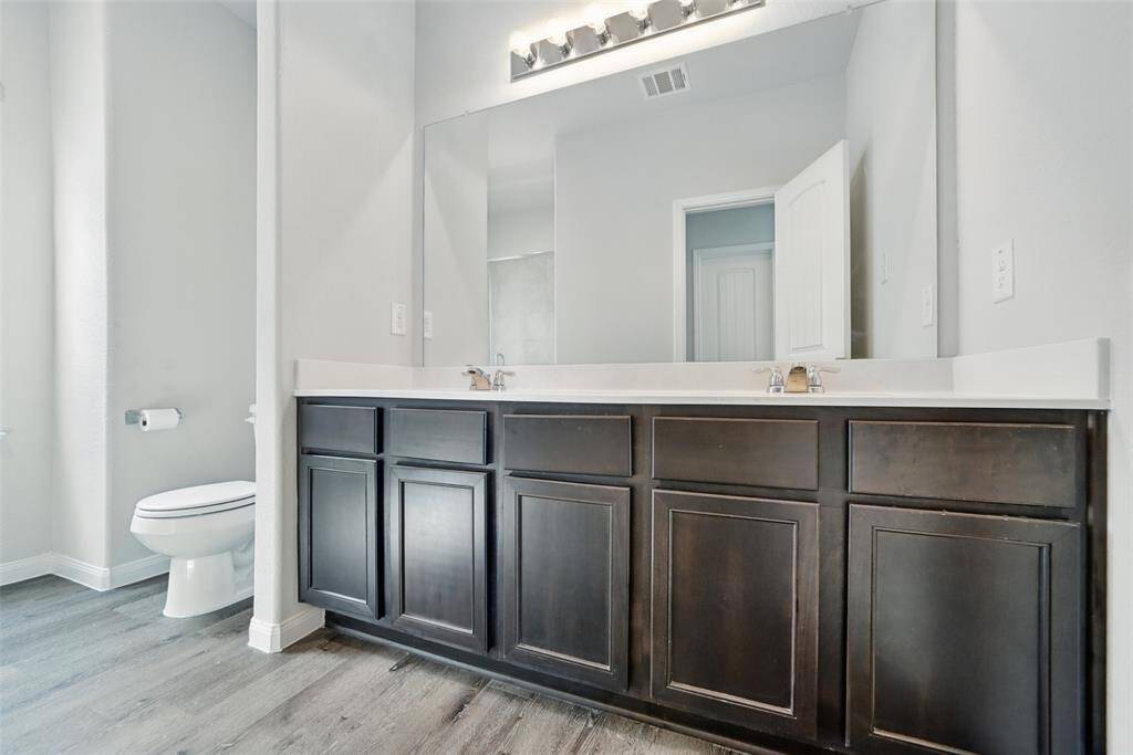 Primary bathroom is generous in size