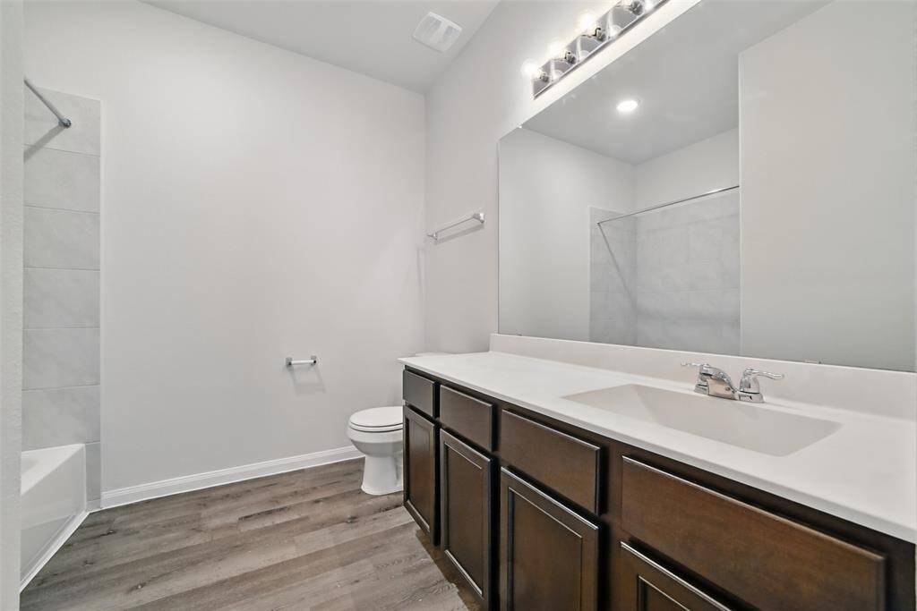 Secondary bathroom for the 2 additional bedrooms- has a tub/shower combo