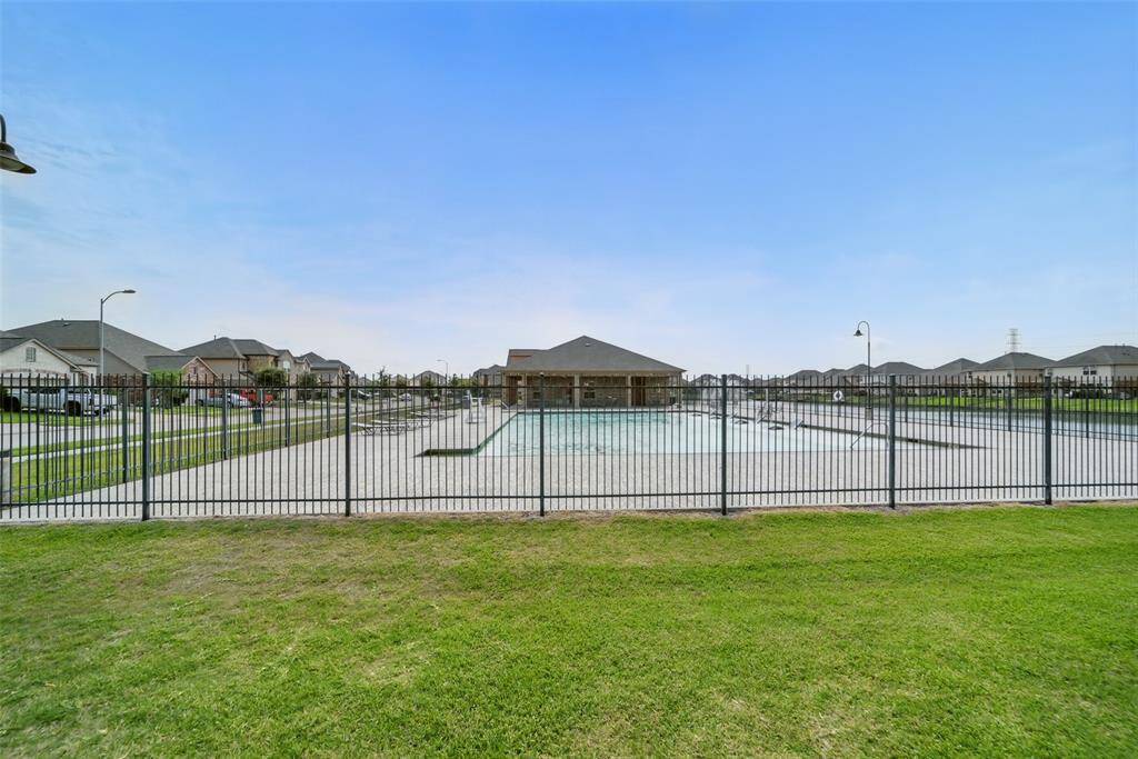 perfect for the summer, this pool also has a "sunning bed" for folks to relax in the water