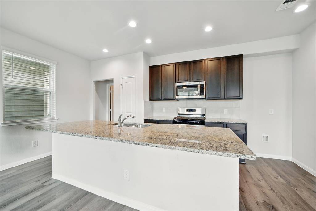 Great island with gorgeous granite and storage underneath