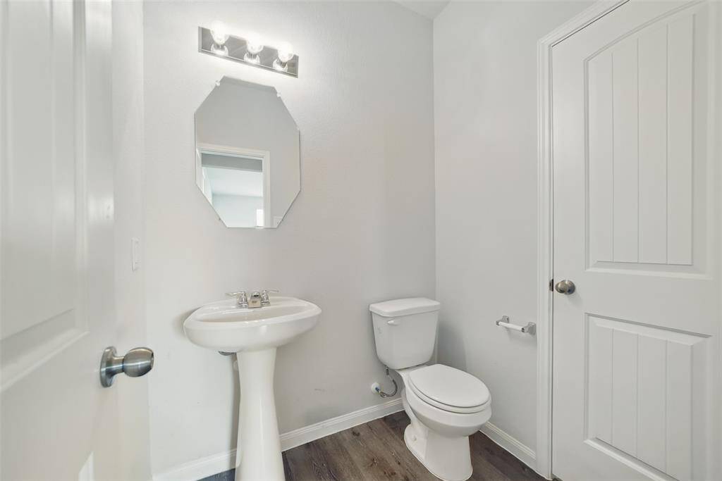 Guest bathroom with huge storage that goes under the stairs