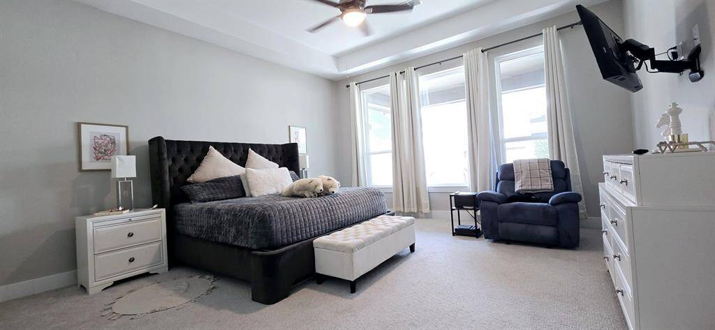 The primary bedroom includes a walk-in closet and an en-suite bathroom with a built in linen closet.