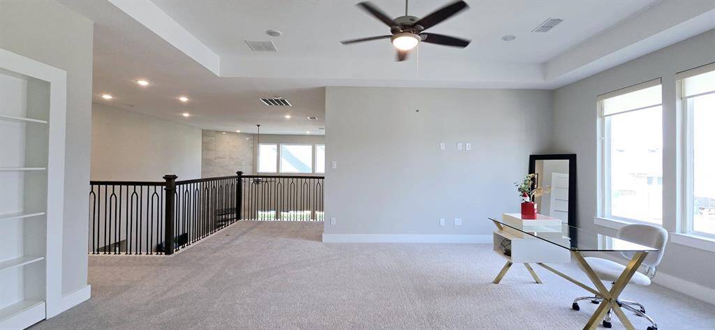cozy and versatile upstairs Family room, soft carpeting.
