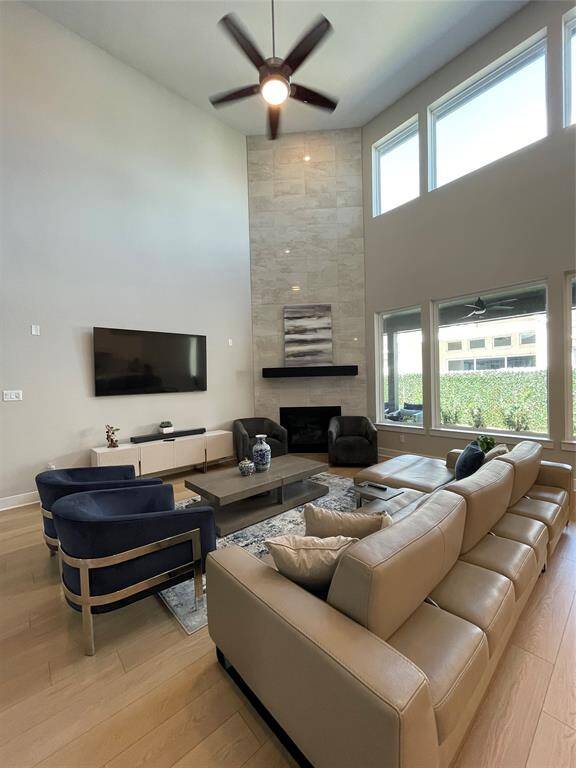 Living Room with double height ceilings giving a sense of expansive atmosphere. Large windows allowing the flood of natural light.