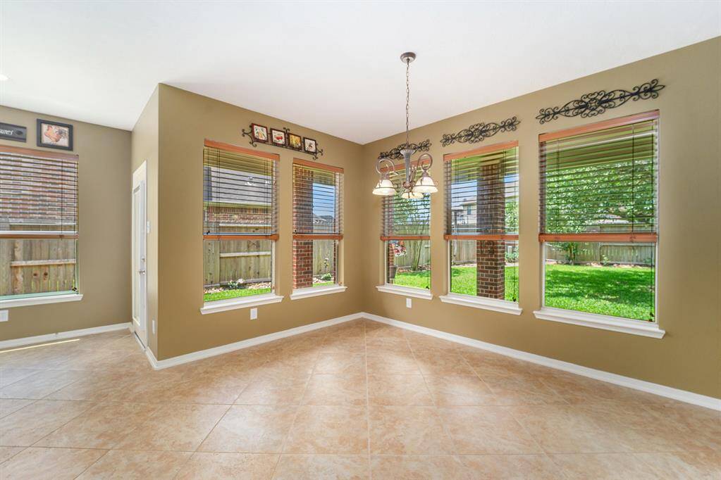 A bright casual dining space in the kitchen will be the HUB of the home!  Tons of windows with great views of the backyard space!